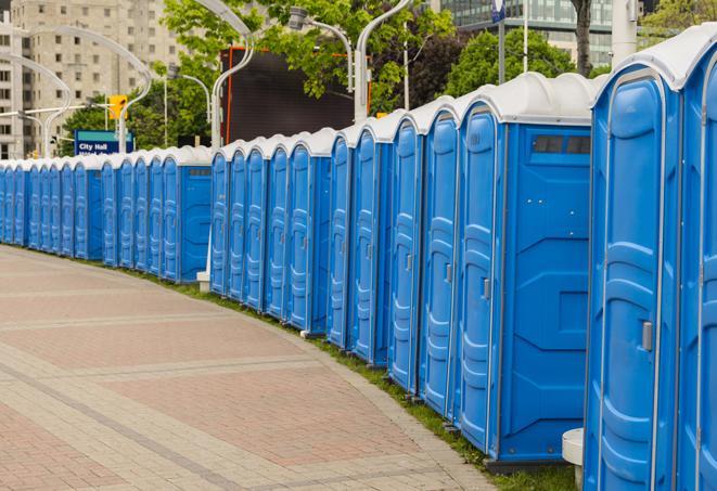 a row of portable restrooms set up for a large athletic event, allowing participants and spectators to easily take care of their needs in Eagle, ID